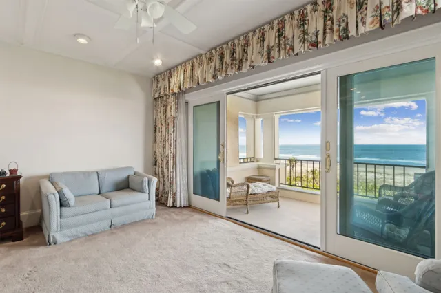 a swimming pool with outdoor seating and yard