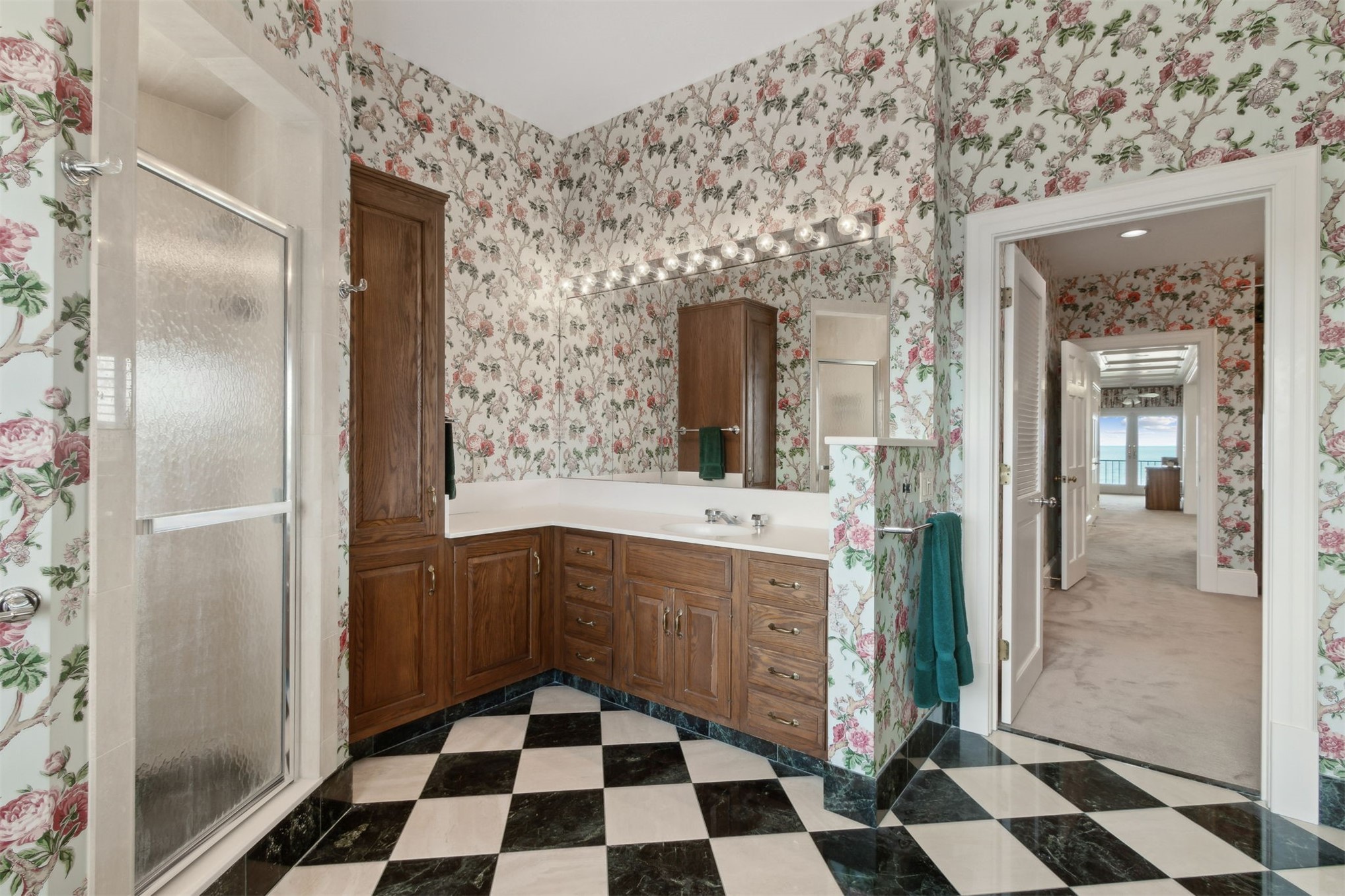 28 Dunes Row Fernandina Beach, FL 32034 - Photo 48 of 99 a kitchen with a checkered floor and white cabinets