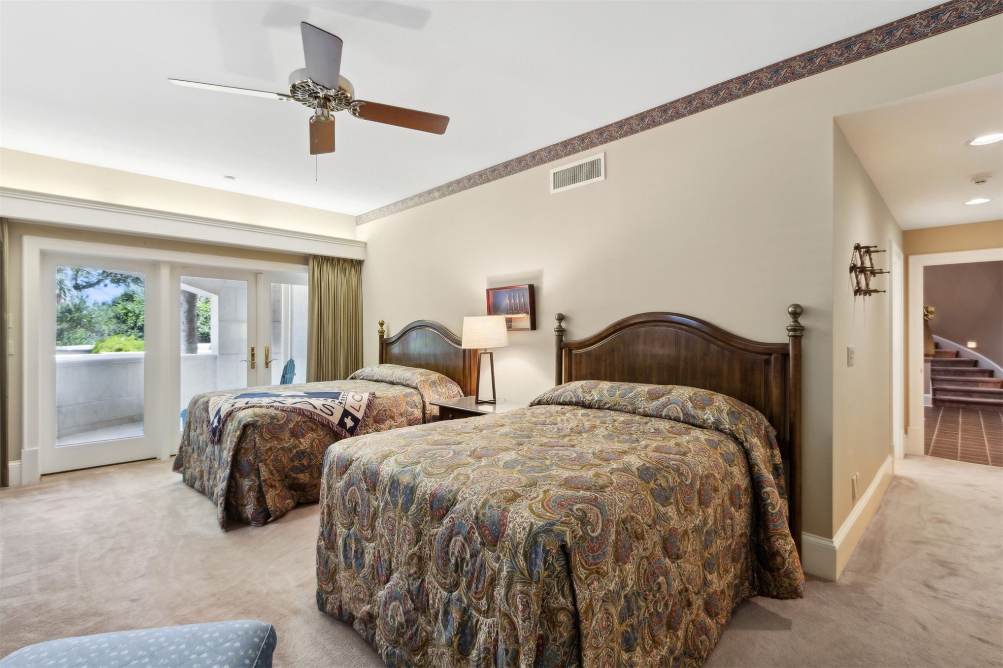 28 Dunes Row Fernandina Beach, FL 32034 - Photo 55 of 99 a bedroom with two beds and painting on the wall