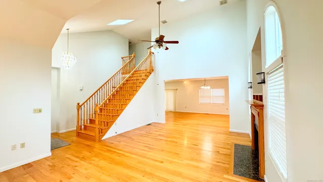 a view of a kitchen with a sink and a fireplace