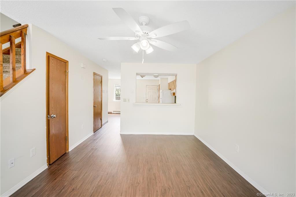 975 Meriden Road, Unit 90 Waterbury, CT 06705 - Photo 1 of 1 a view of a livingroom with wooden floor