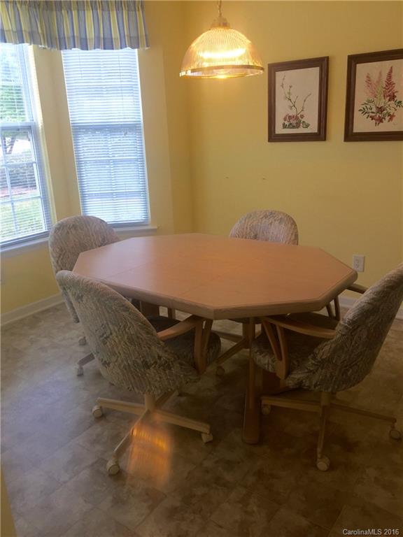1003 Platinum Drive Fort Mill, SC 29708 - Photo 4 of 20 a view of a dining room with furniture and a window