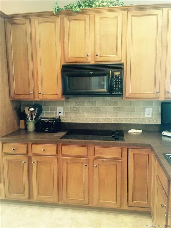 1003 Platinum Drive Fort Mill, SC 29708 - Photo 5 of 20 a kitchen with granite countertop white cabinets and sink