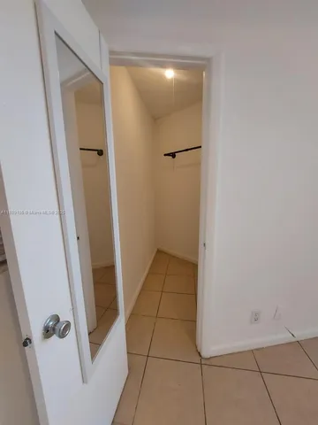 a white stove top oven sitting inside of a kitchen