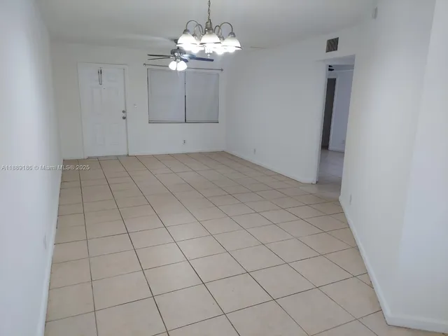 an empty room with chandelier