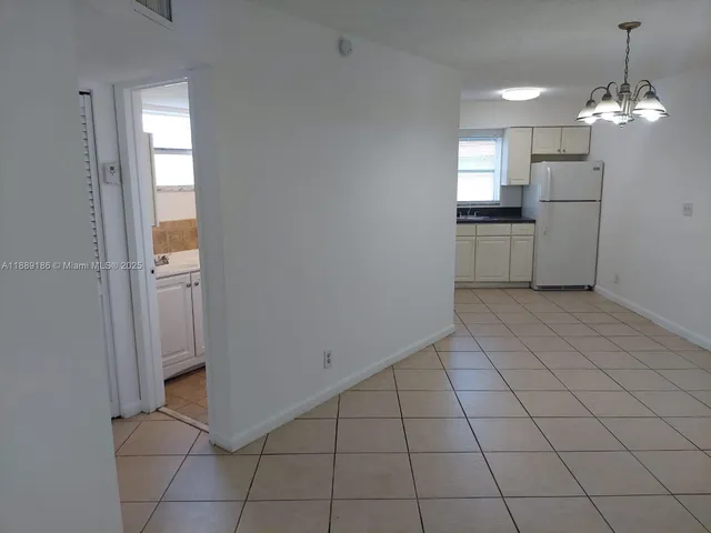 a view of a kitchen and a sink