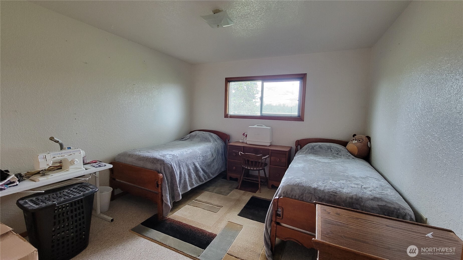 1296 Highway 12 Chehalis, WA 98532 - Photo 16 of 33 a bedroom with a bed and wooden floor