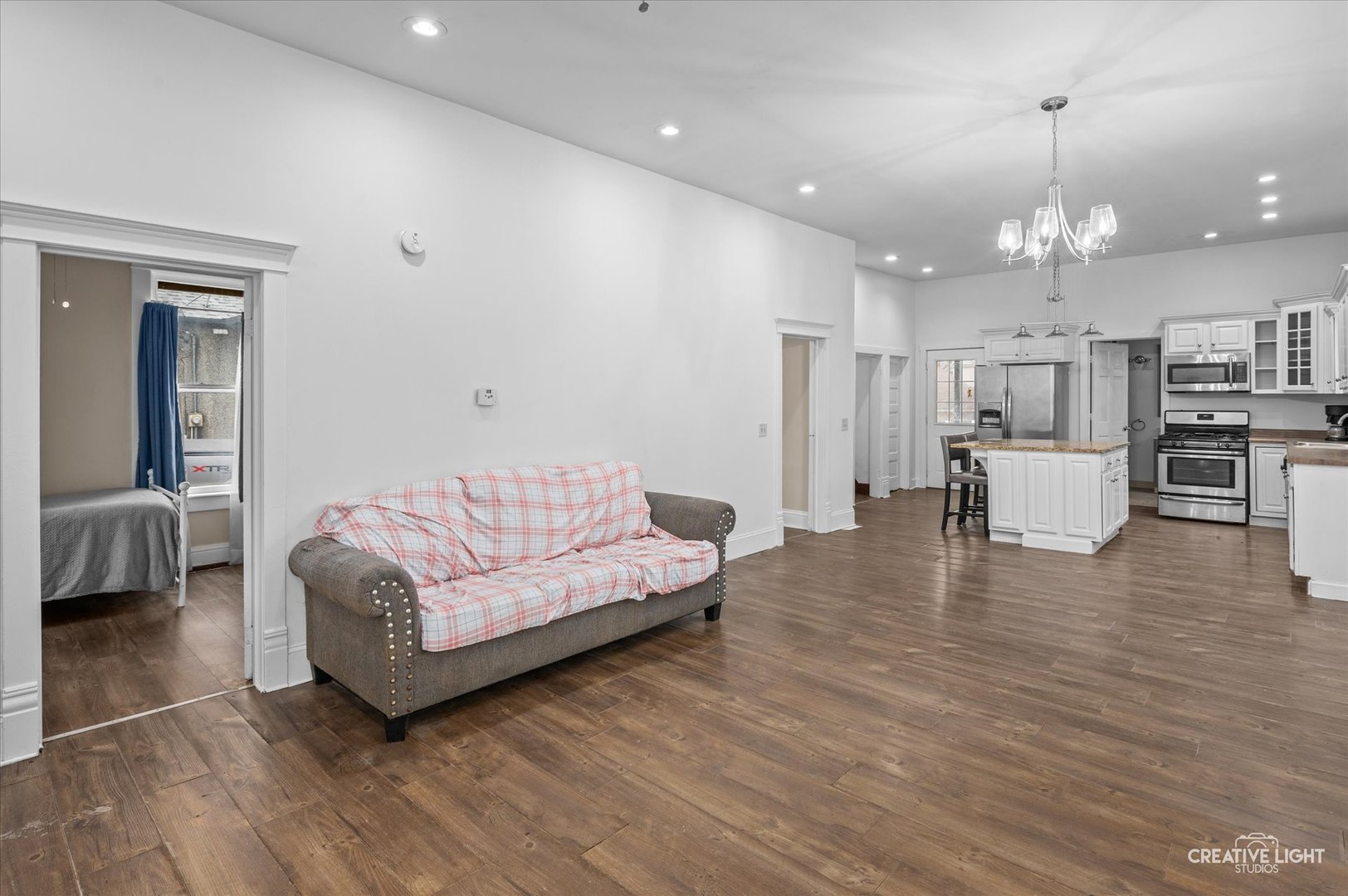 1409 Pulaski Street Peru, IL 61354 - Photo 3 of 20 a living room with furniture and a wooden floor