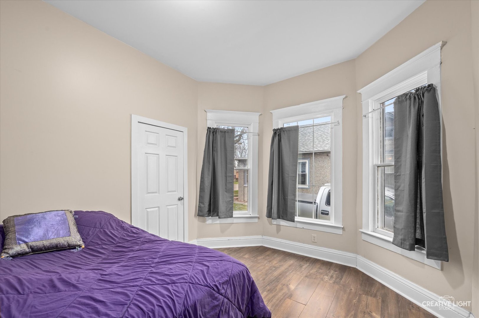 1409 Pulaski Street Peru, IL 61354 - Photo 8 of 20 a bedroom with a large bed and a window