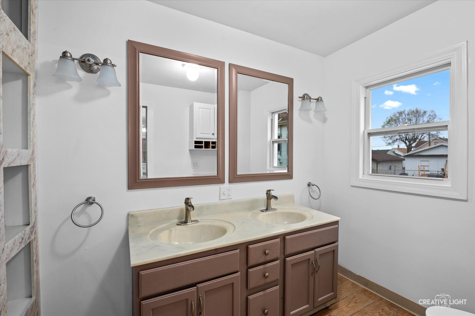1409 Pulaski Street Peru, IL 61354 - Photo 10 of 20 a bathroom with a sink and a mirror