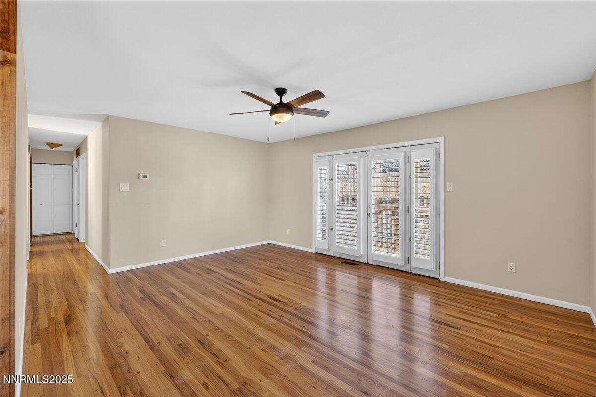 1495 Doric Drive Reno, NV 89503 - Photo 11 of 42 wooden floor in an empty room with a window