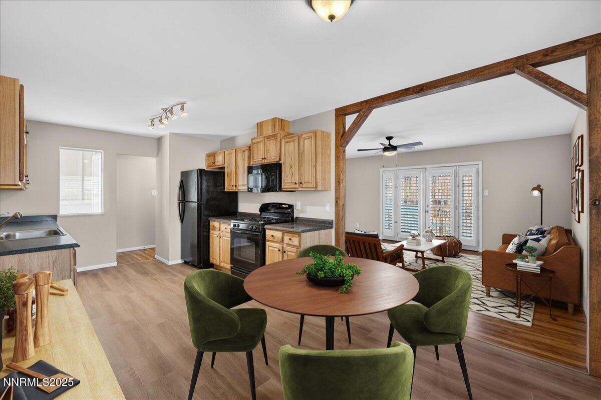 1495 Doric Drive Reno, NV 89503 - Photo 12 of 42 a living room with furniture a dining table and kitchen view