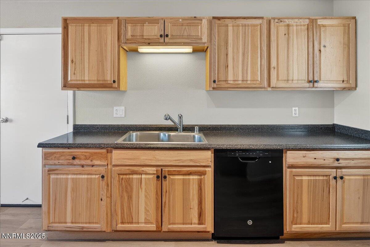 1495 Doric Drive Reno, NV 89503 - Photo 19 of 42 a kitchen with stainless steel appliances granite countertop a stove and a microwave