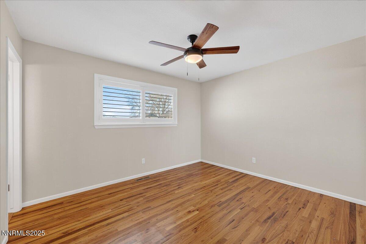1495 Doric Drive Reno, NV 89503 - Photo 20 of 42 a view of empty room with wooden floor