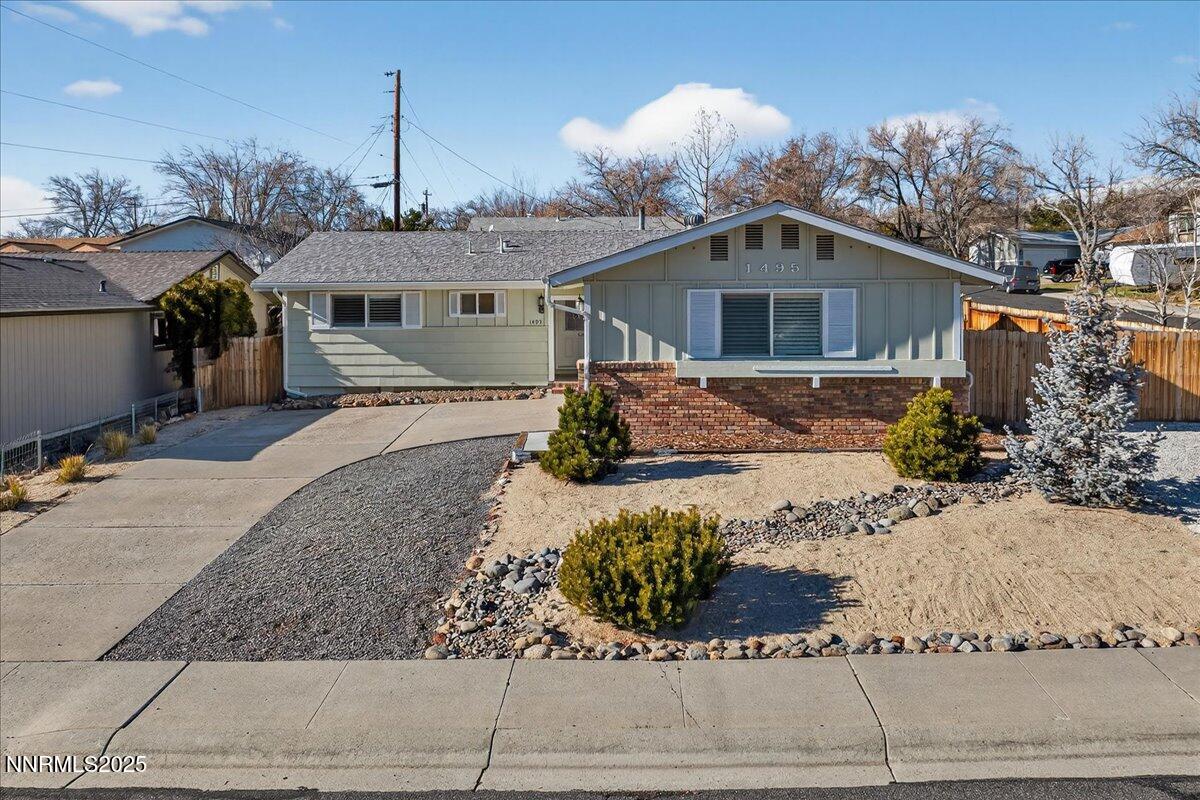 1495 Doric Drive Reno, NV 89503 - Photo 2 of 42 a front view of a house with a yard