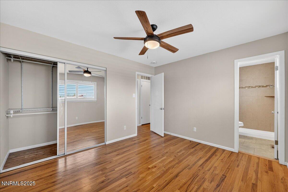 1495 Doric Drive Reno, NV 89503 - Photo 21 of 42 a view of a room with wooden floor and white walls