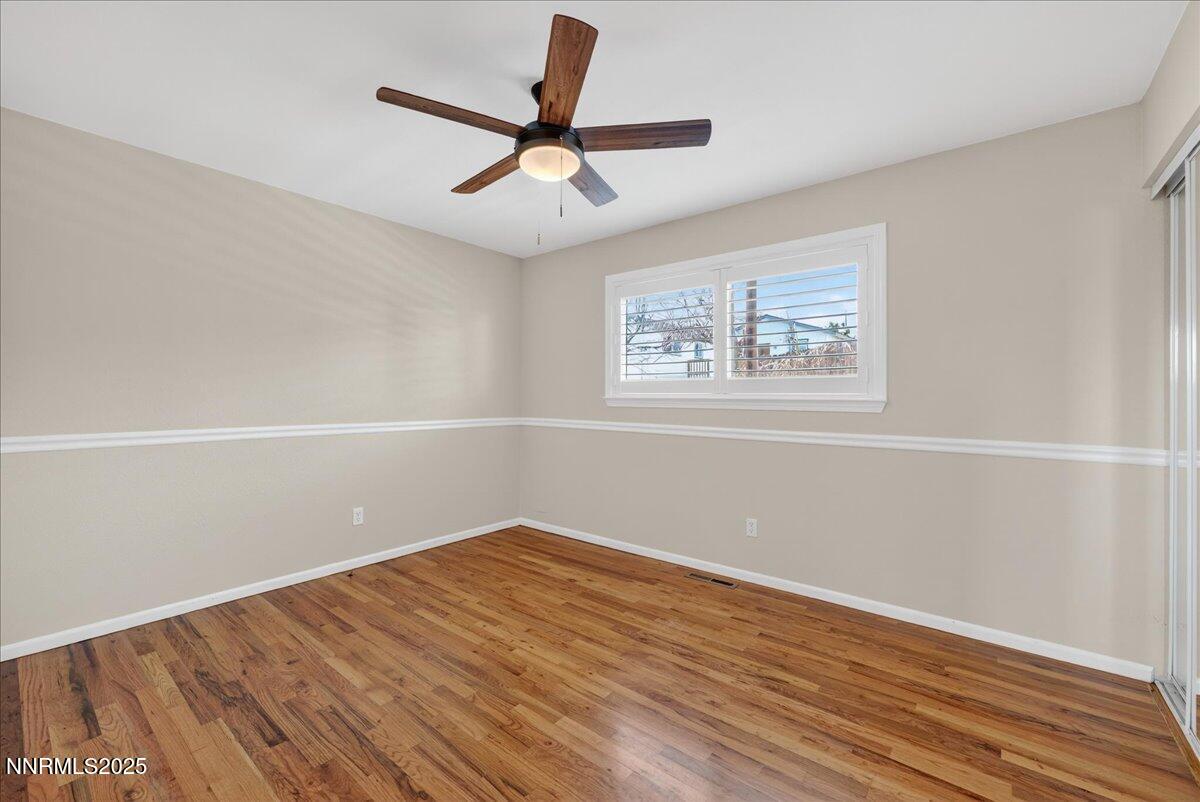 1495 Doric Drive Reno, NV 89503 - Photo 23 of 42 wooden floor in an empty room with a window