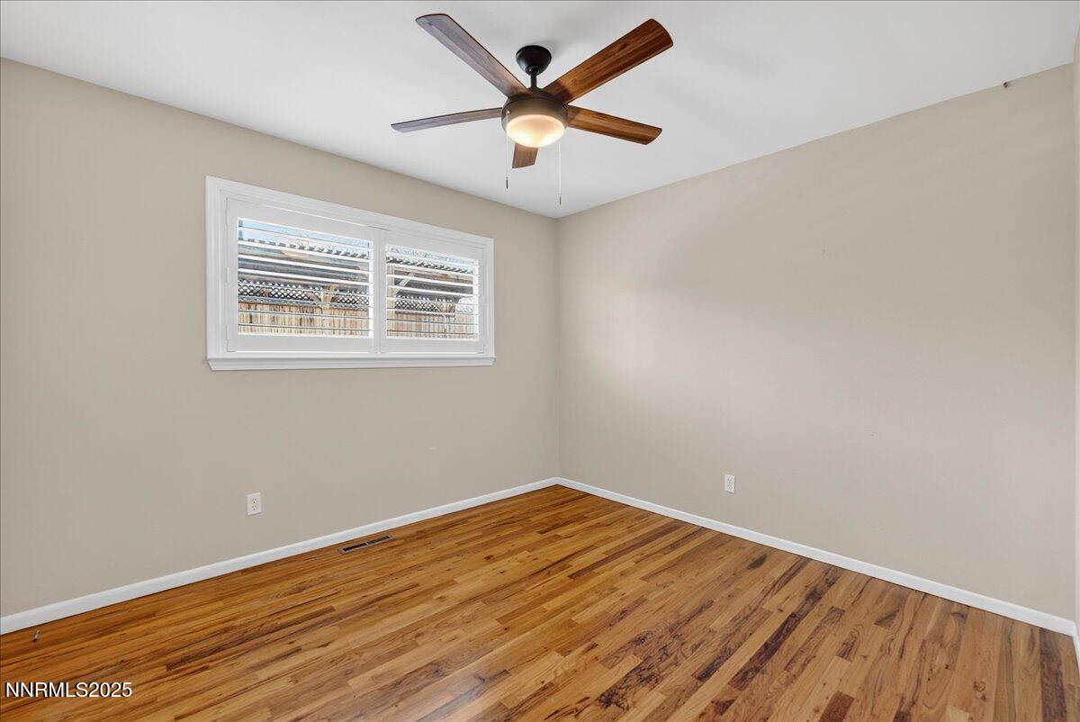 1495 Doric Drive Reno, NV 89503 - Photo 25 of 42 wooden floor in an empty room with a window