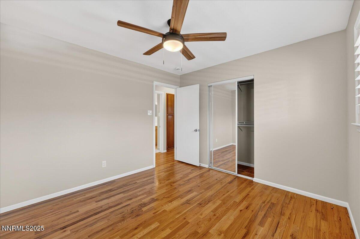 1495 Doric Drive Reno, NV 89503 - Photo 26 of 42 a view of empty room with wooden floor