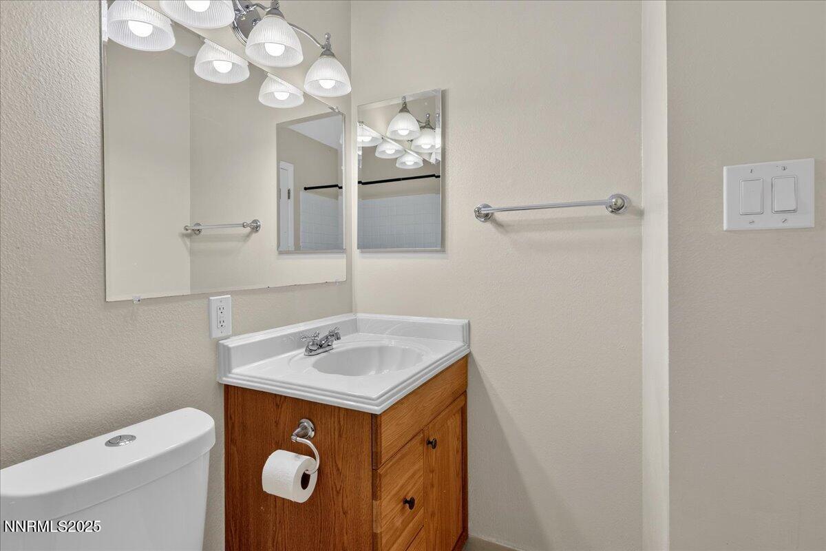 1495 Doric Drive Reno, NV 89503 - Photo 27 of 42 a bathroom with a sink a vanity and a mirror