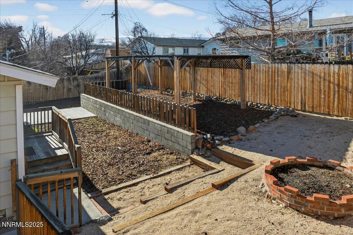 1495 Doric Drive Reno, NV 89503 - Photo 33 of 42 a view of a roof deck with wooden floor and fence