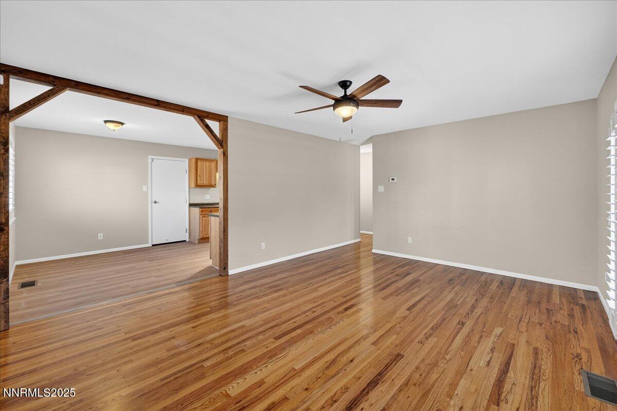 1495 Doric Drive Reno, NV 89503 - Photo 10 of 42 a view of empty room with wooden floor and ceiling fan
