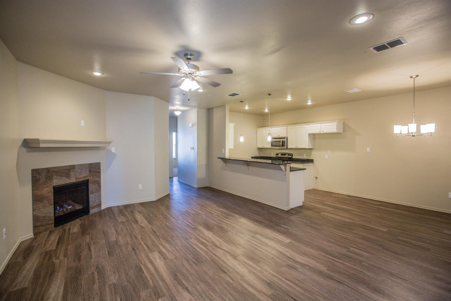 2123 10th Street Lubbock, TX 79401 - Photo 3 of 14 a view of kitchen with sink and microwave