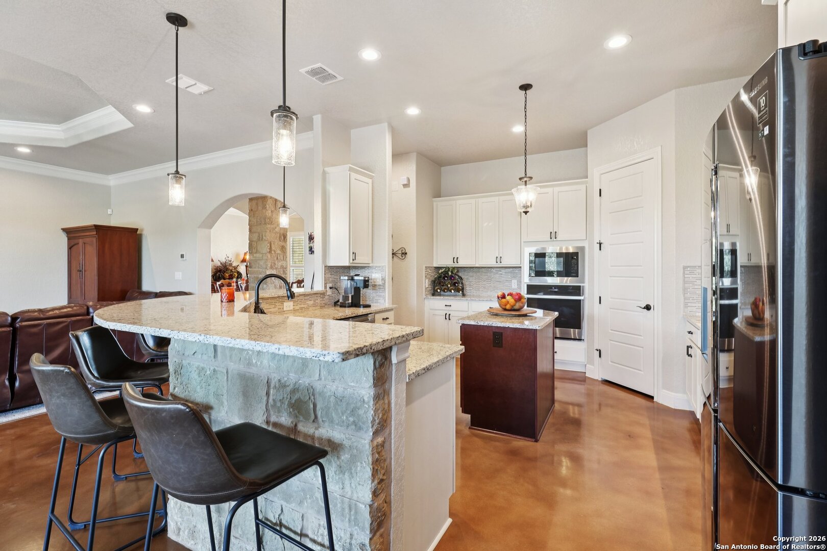 156 Pr 2771 Mico, TX 78056 - Photo 15 of 50 a kitchen with kitchen island granite countertop a table and chairs in it