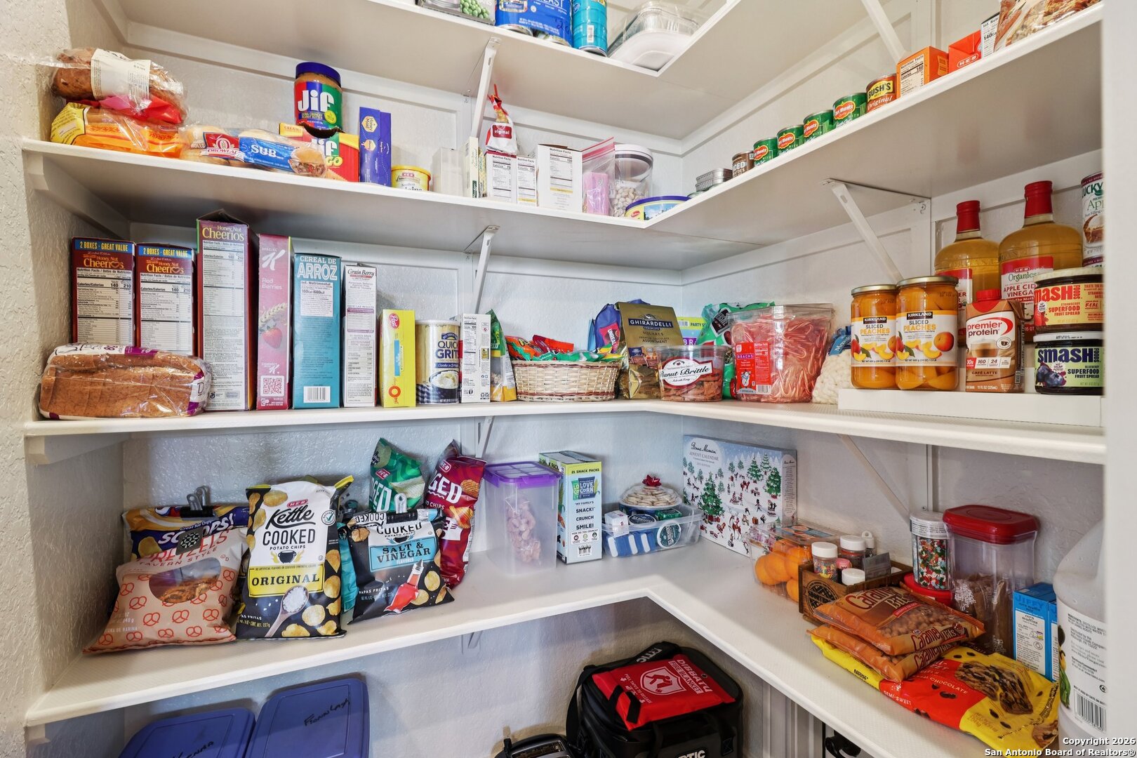 156 Pr 2771 Mico, TX 78056 - Photo 18 of 50 a utility room with lots of clutter and toys