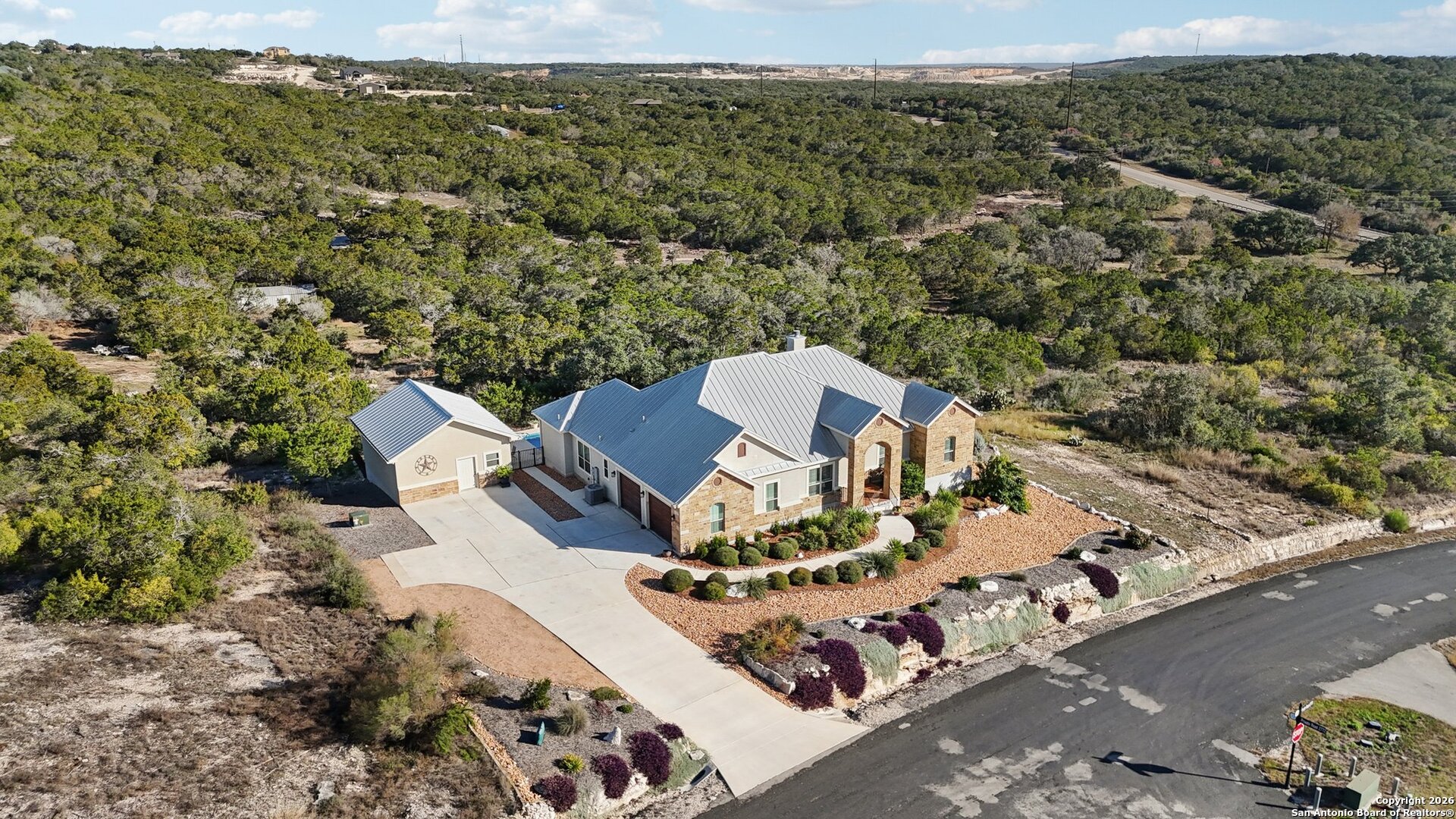 156 Pr 2771 Mico, TX 78056 - Photo 42 of 50 an aerial view of a house with a mountain
