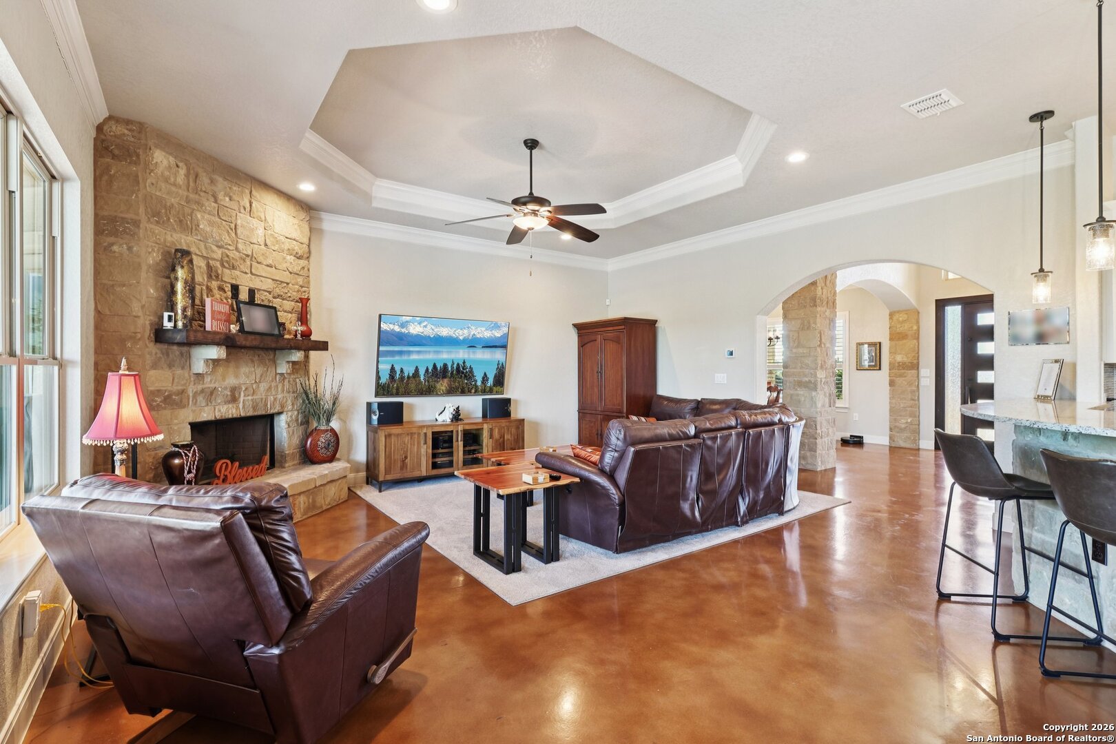 156 Pr 2771 Mico, TX 78056 - Photo 9 of 50 a living room with fireplace furniture and a chandelier