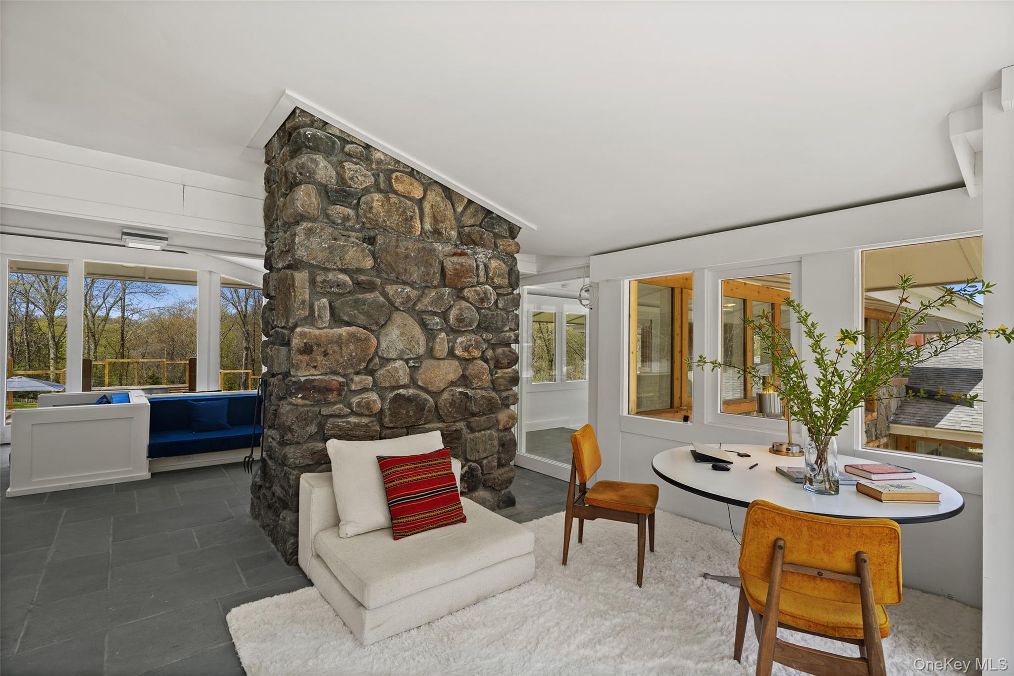 496 Haines Road Bedford Corners, NY 10549 - Photo 14 of 35 a living room with patio furniture and a large window