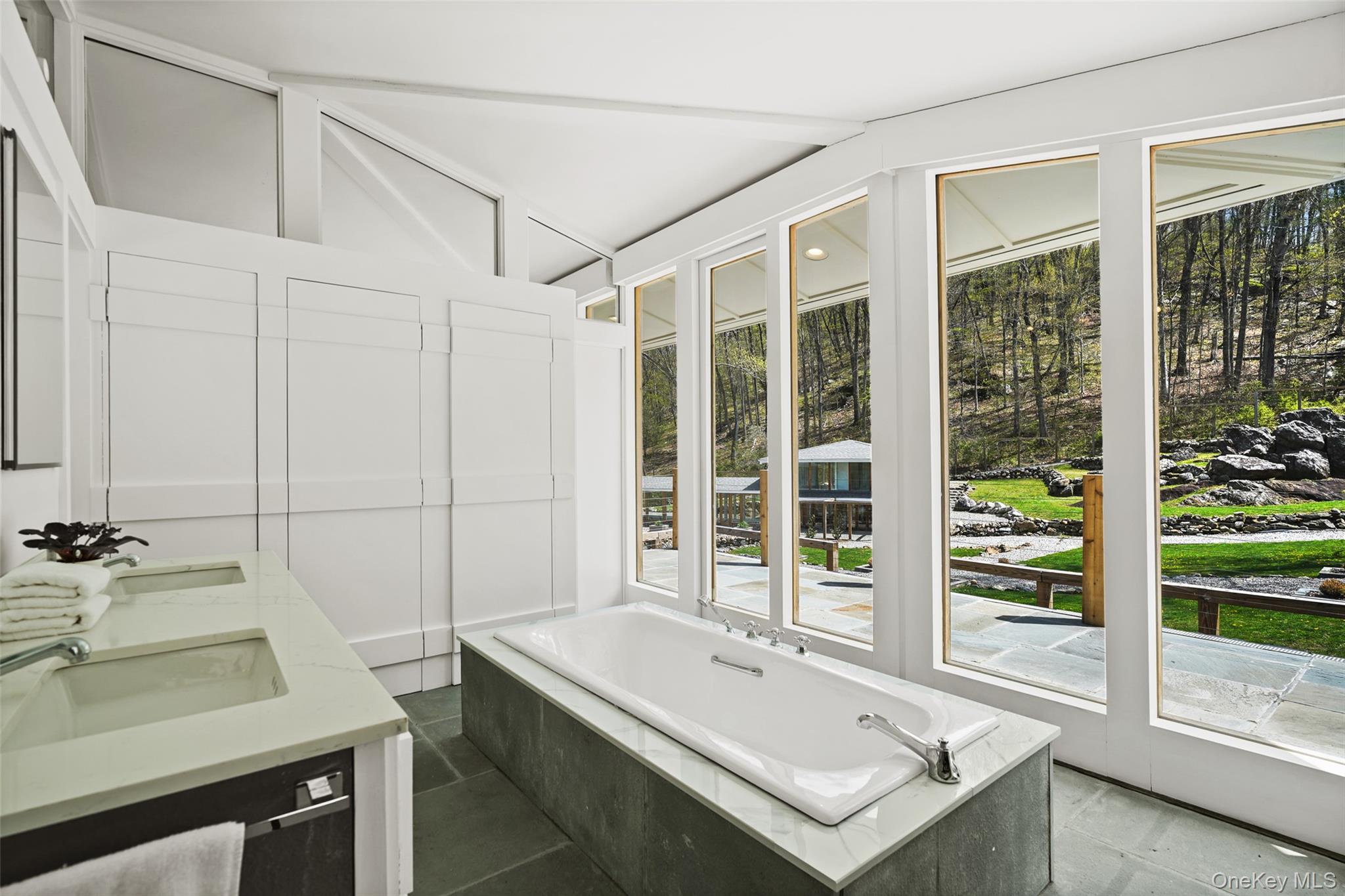 496 Haines Road Bedford Corners, NY 10549 - Photo 21 of 35 a bathroom with a tub sink and mirror