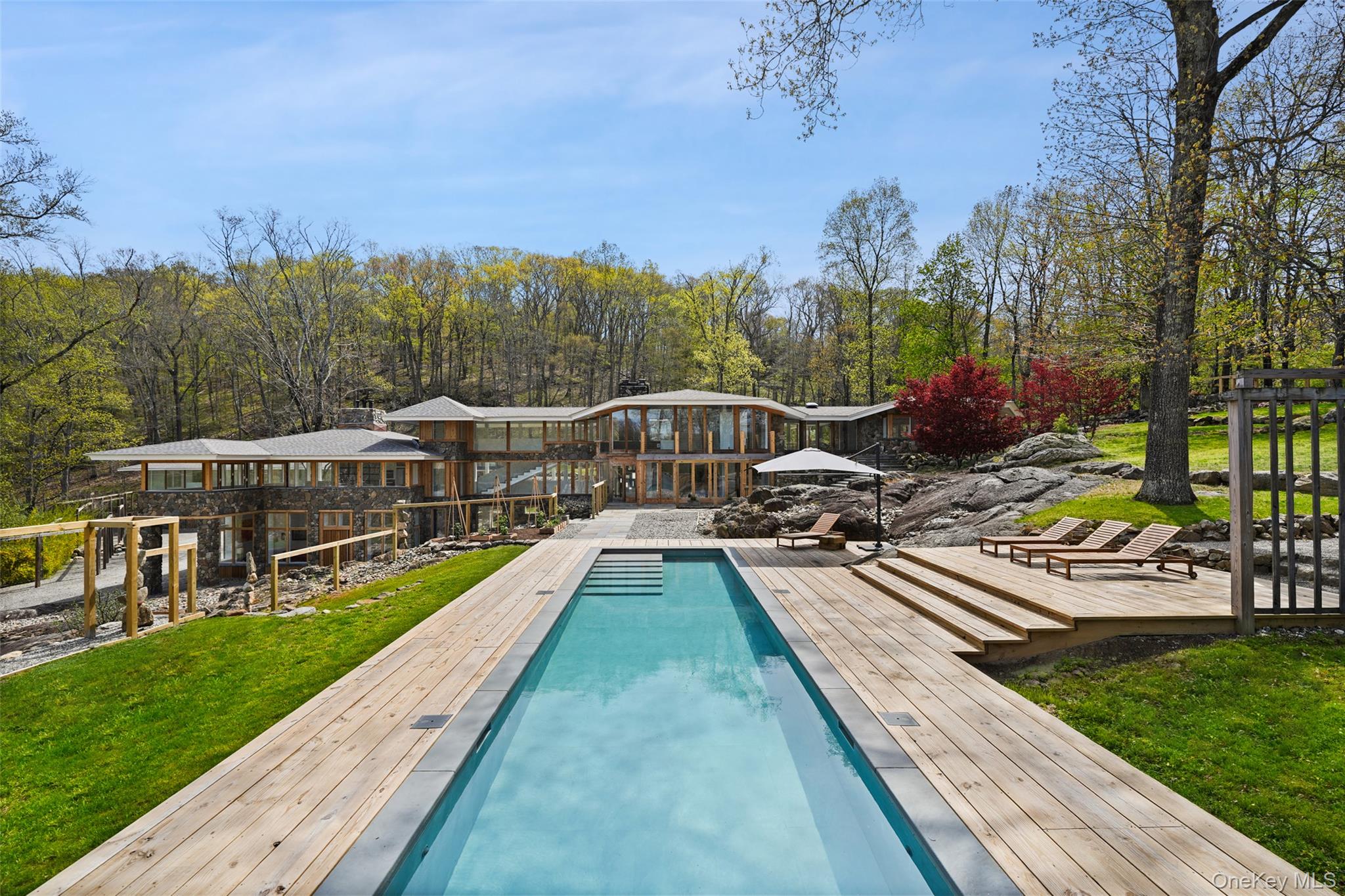 496 Haines Road Bedford Corners, NY 10549 - Photo 3 of 35 a view of a house with swimming pool and sitting area