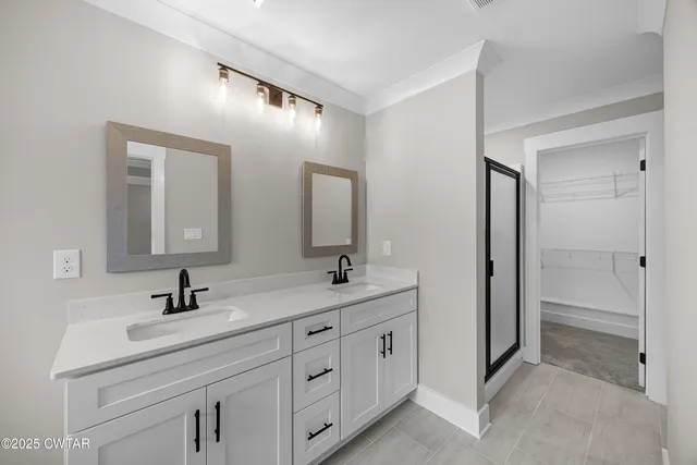 a bathroom with a bathtub sink and mirror
