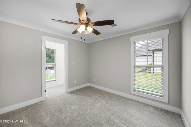 a view of an empty room with a window