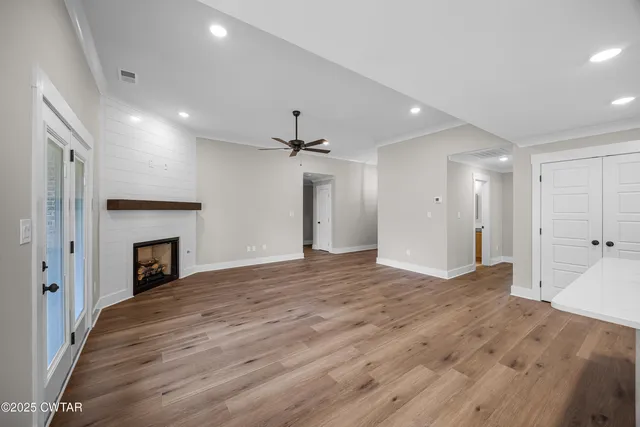a view of kitchen and hall with wooden floor