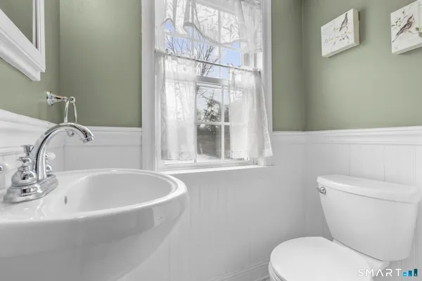 a bathroom with a toilet and a sink