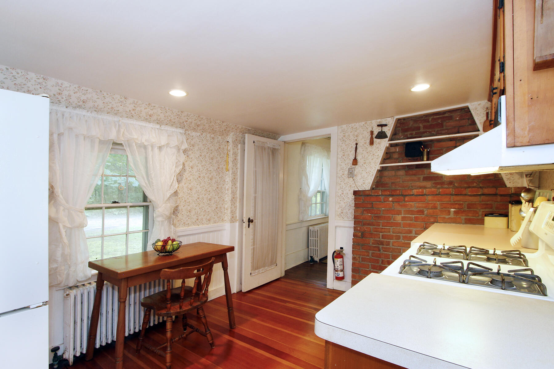 958 Long Pond Road Brewster, MA 02631 - Photo 12 of 38 a view of a dining room with furniture window and wooden floor