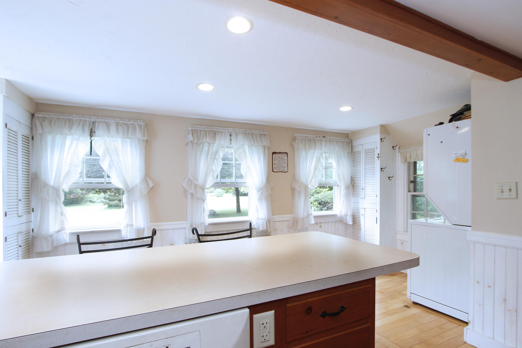 958 Long Pond Road Brewster, MA 02631 - Photo 13 of 38 a kitchen with kitchen island a sink wooden floor and window