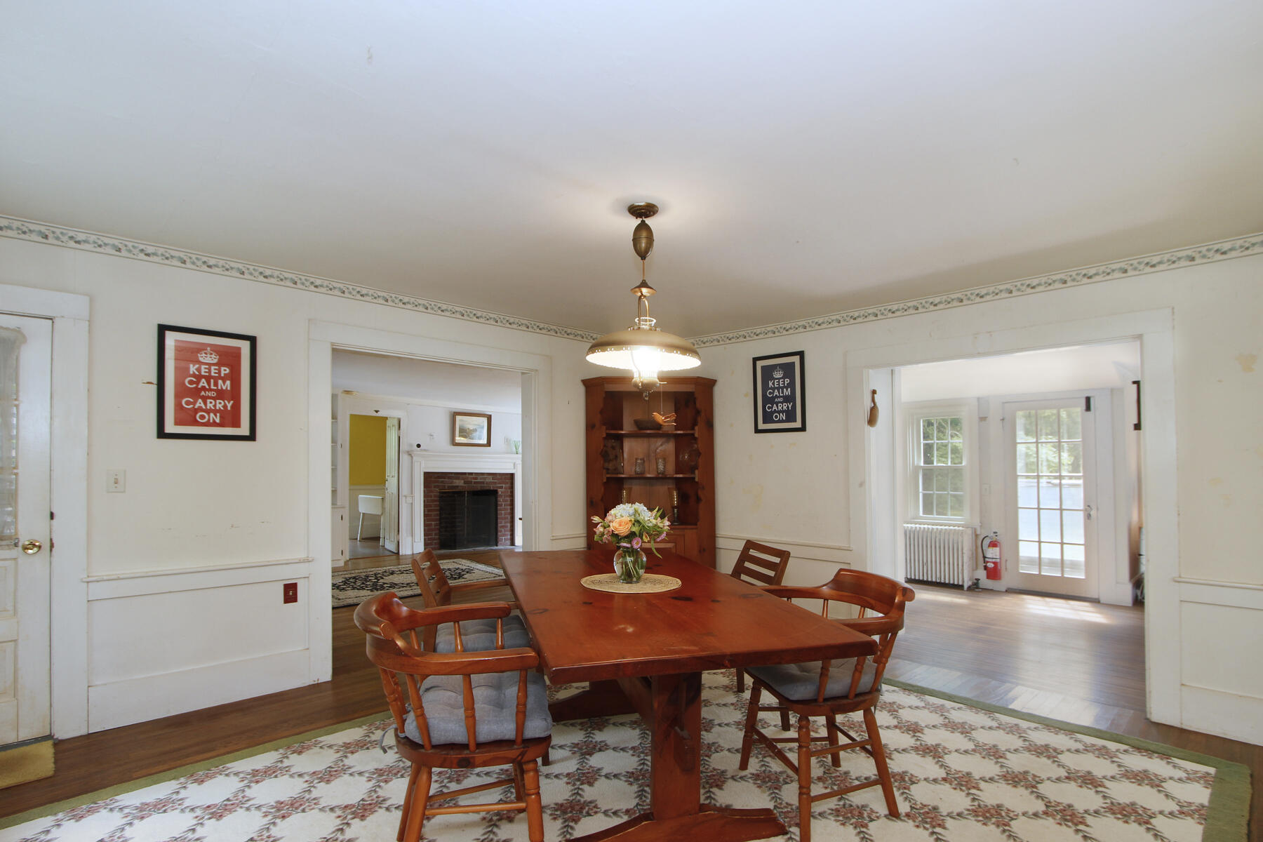 958 Long Pond Road Brewster, MA 02631 - Photo 15 of 38 a view of a dining room with furniture and wooden floor