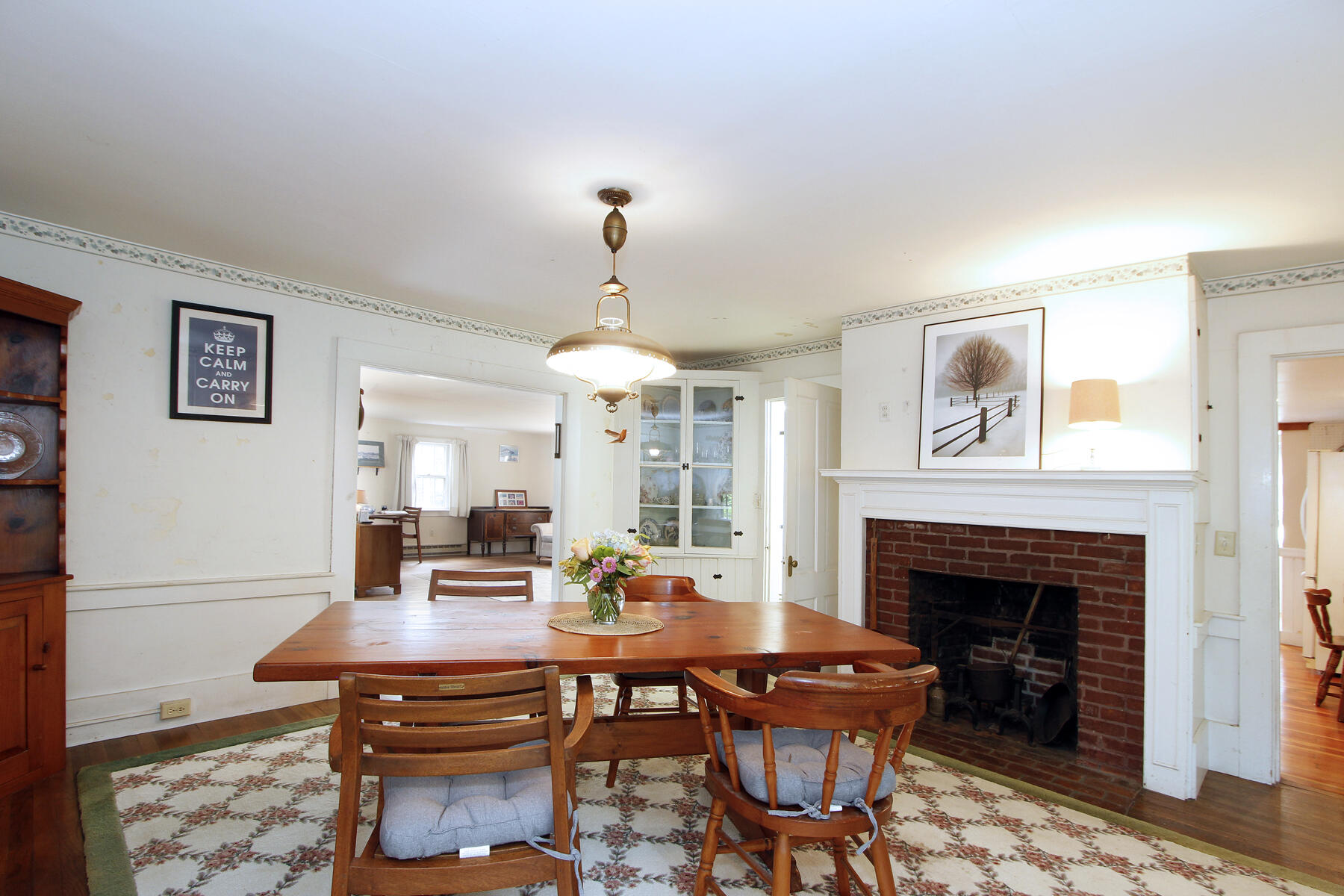 958 Long Pond Road Brewster, MA 02631 - Photo 16 of 38 a view of a dining room with furniture and chandelier