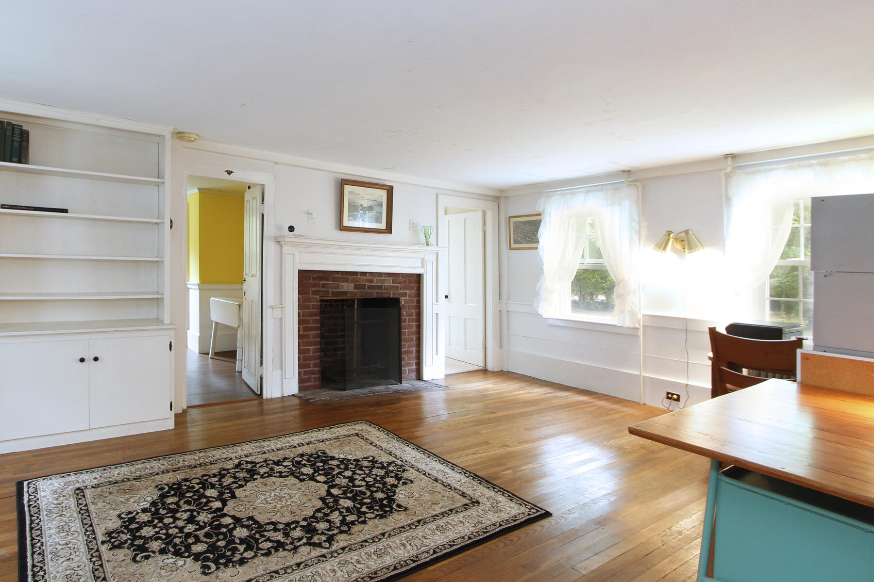 958 Long Pond Road Brewster, MA 02631 - Photo 20 of 38 a living room with a couch and a fireplace