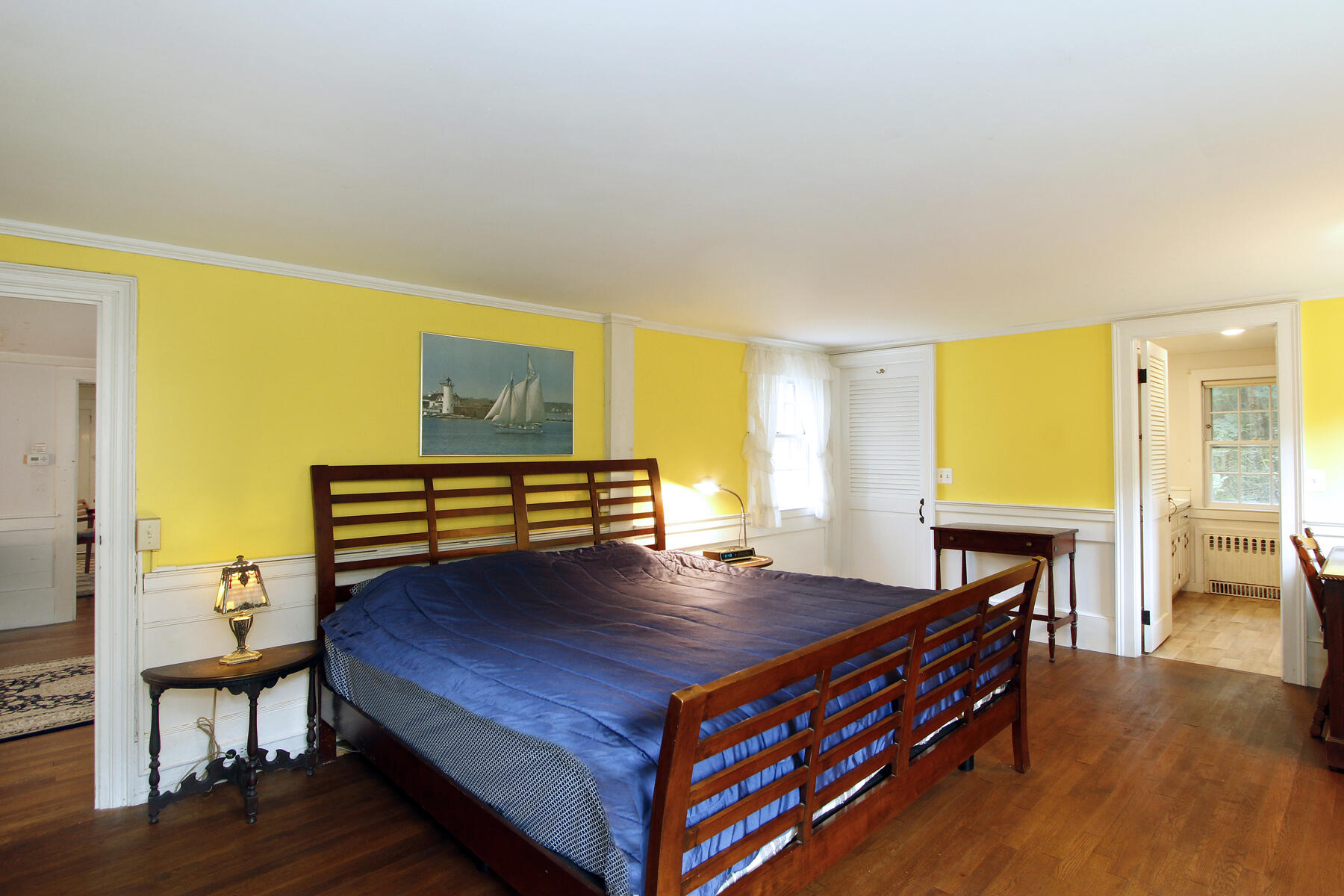 958 Long Pond Road Brewster, MA 02631 - Photo 22 of 38 a living room with a table chairs and a fireplace