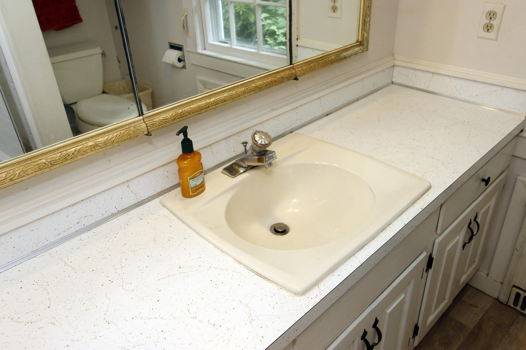 958 Long Pond Road Brewster, MA 02631 - Photo 23 of 38 a bathroom with a sink and mirror