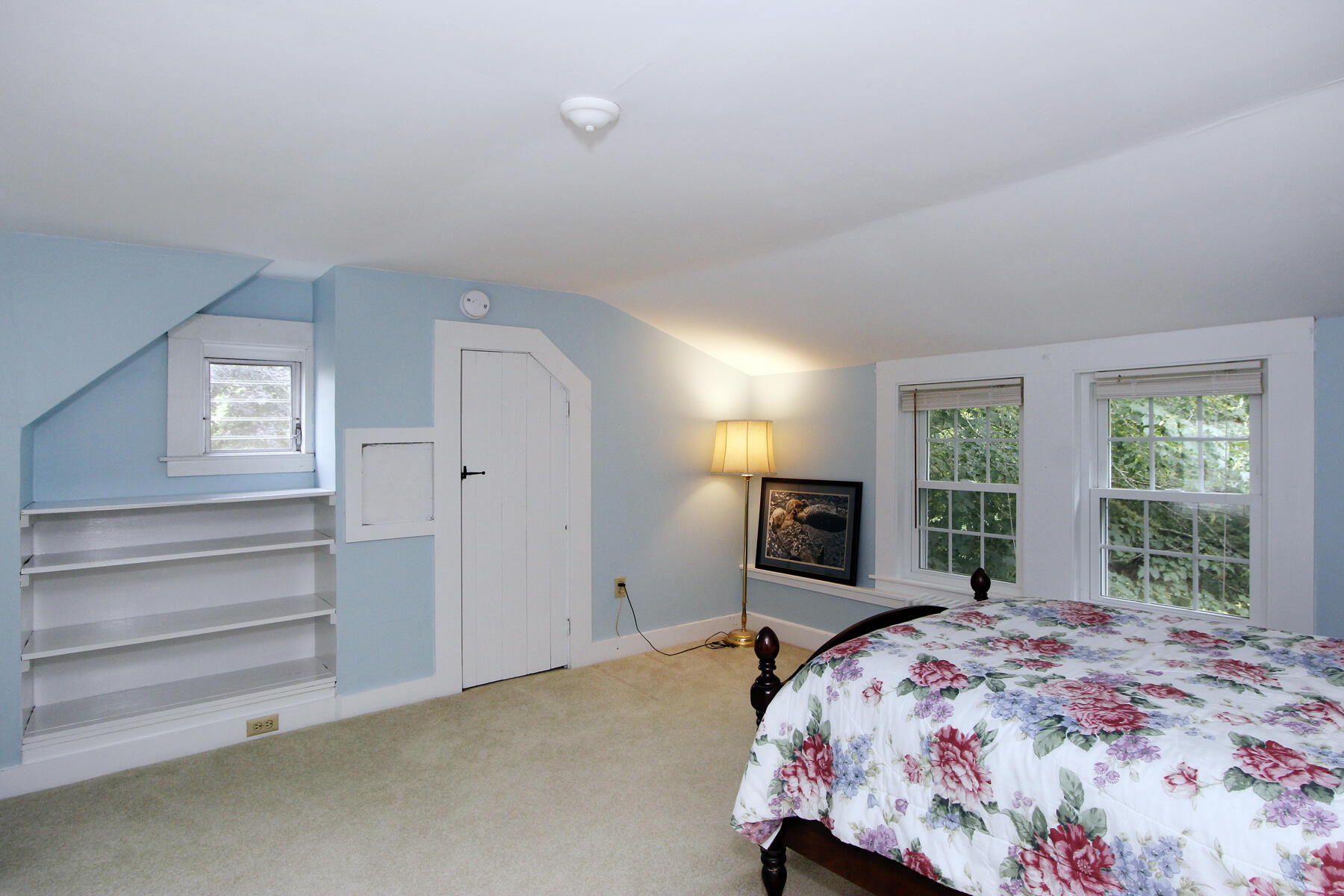 958 Long Pond Road Brewster, MA 02631 - Photo 29 of 38 a bedroom with a bed and a large window
