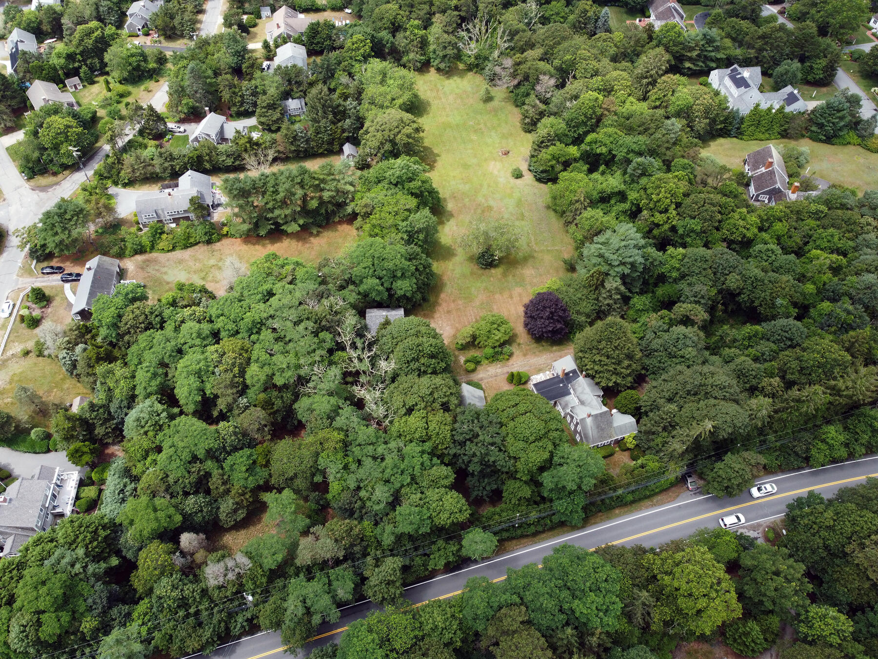 958 Long Pond Road Brewster, MA 02631 - Photo 31 of 38 an aerial view of residential house with outdoor space and trees all around