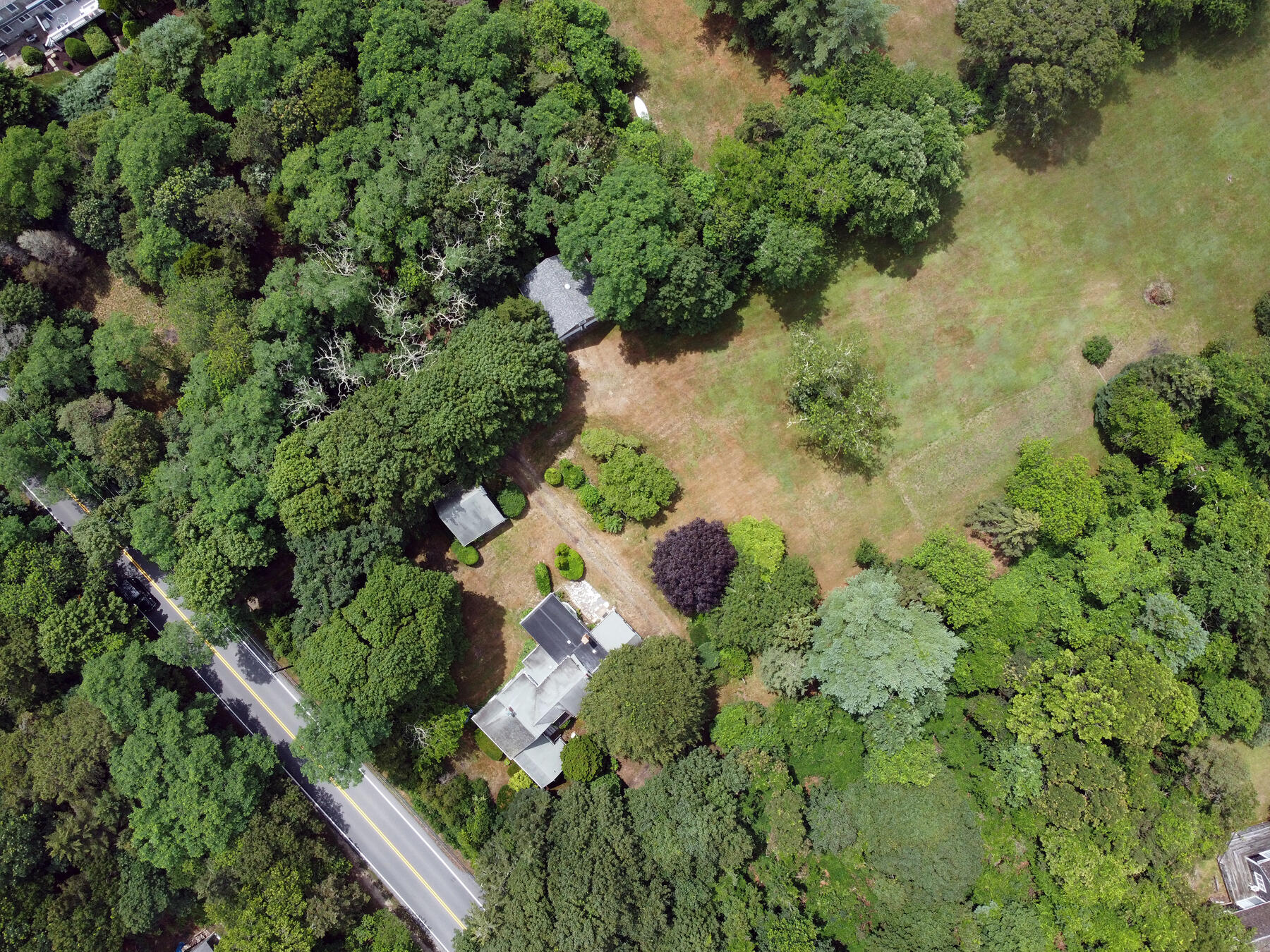 958 Long Pond Road Brewster, MA 02631 - Photo 8 of 38 an aerial view of a house with a yard