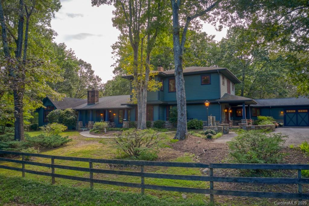 305 Misty Hill Road Columbus, NC 28722 - Photo 2 of 46 a front view of a house with a yard