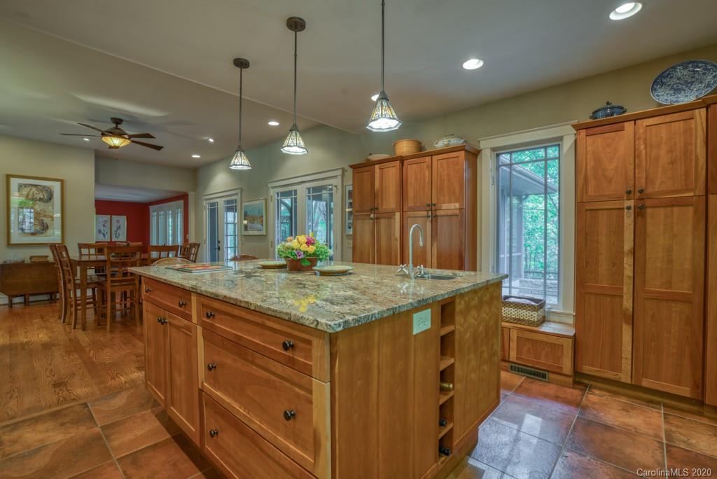 305 Misty Hill Road Columbus, NC 28722 - Photo 12 of 46 a kitchen with a table and chairs in it